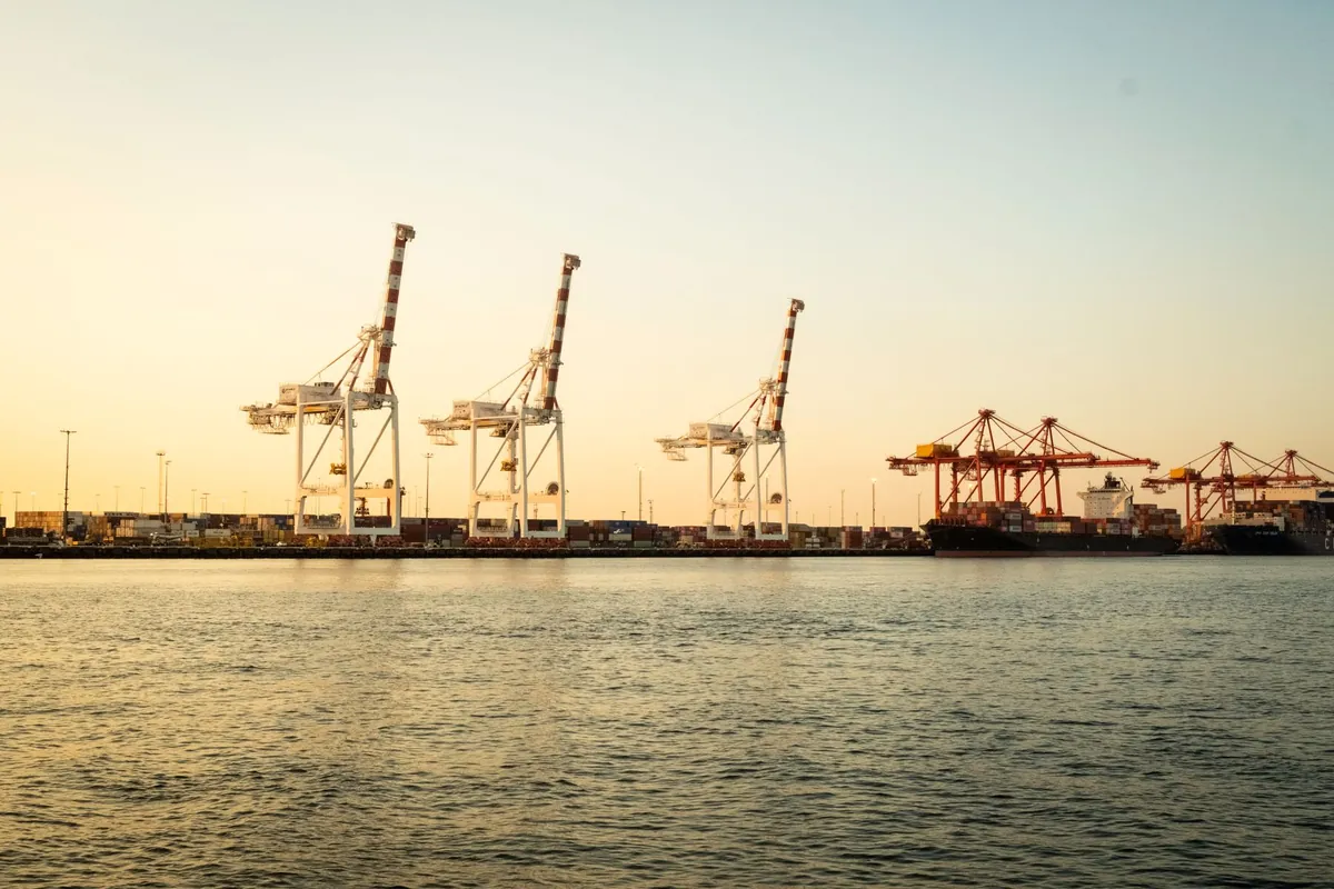 Container cranes at Fremantle Port at sunset, Western Australia